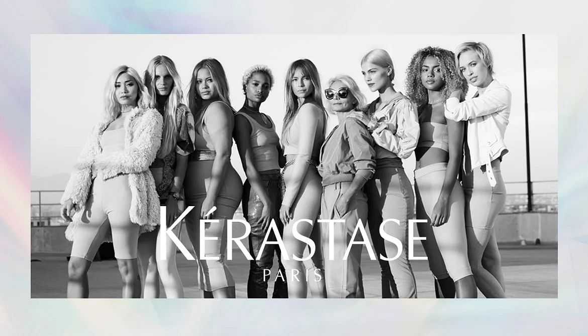 Group of diverse models posing in stylish outfits with "Kérastase Paris" text in the foreground.