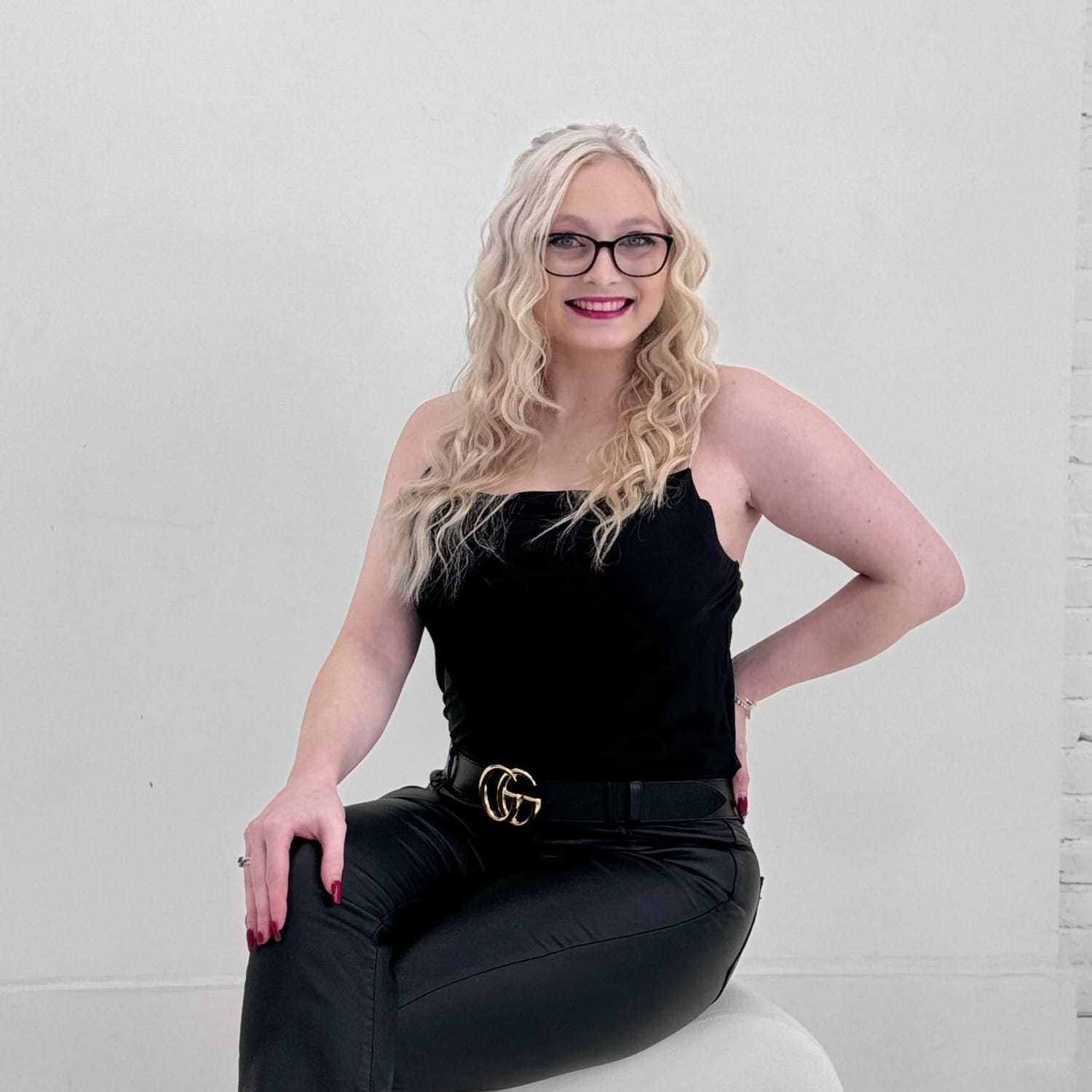 Portrait of Grace Owens, a professional stylist at The Maven and The Muse, showcasing their expertise and style.