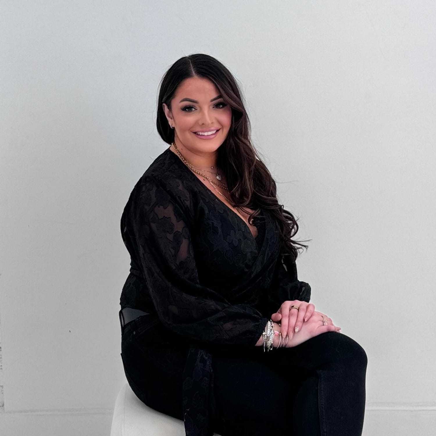 Portrait of Abi Talhouk, a professional stylist at The Maven and The Muse, showcasing their expertise and style.