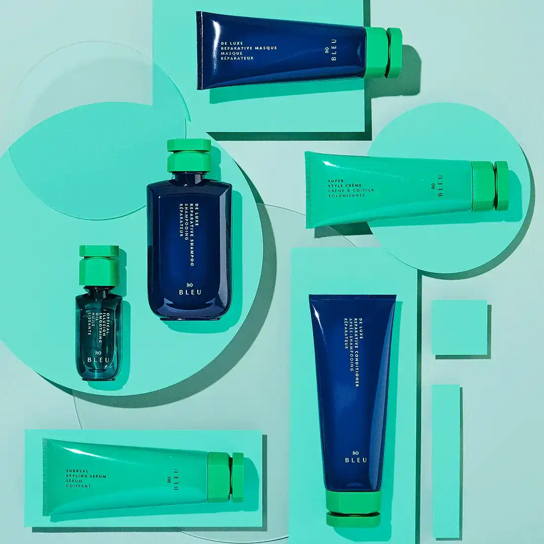 Luxurious green and navy skincare products on a geometric teal background.